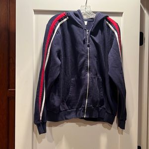 H&M Blue zip up with red and white lines in the side